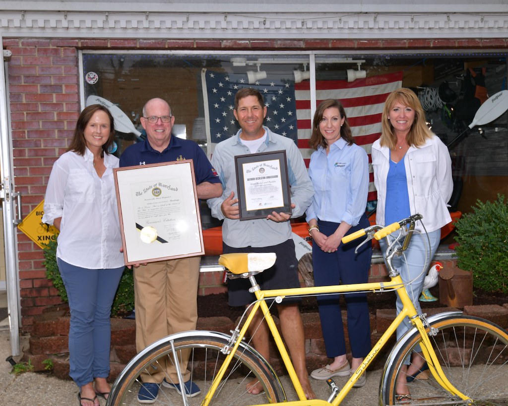 Photo of group in front of bike shop