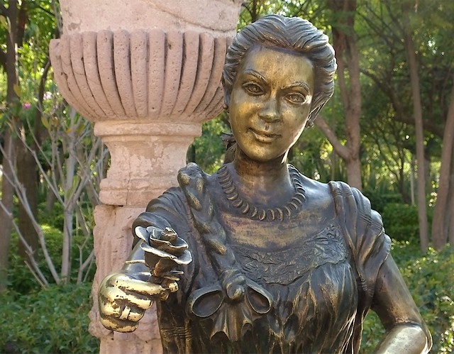 Bronce Statue of a Woman with a flower