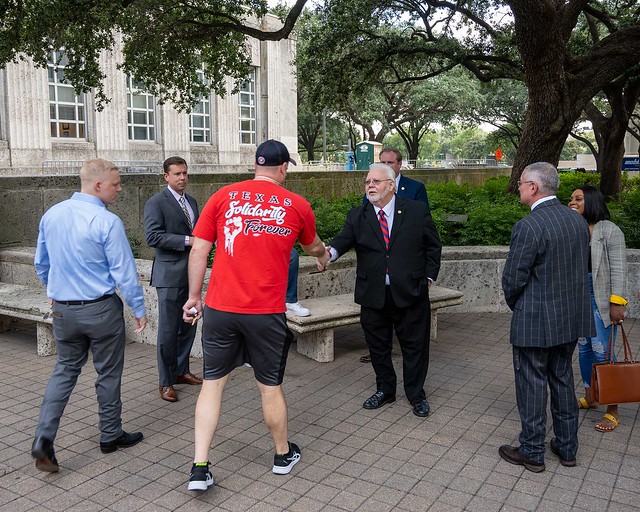 August 9, 2021 Michael Kubosh greets a coalition member.