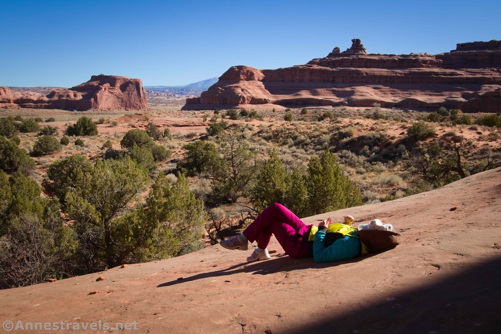 My sister claims I always take photos of her lying down and resting, usually with her hat over her eyes.  So I work hard to keep up that reputation.  Near Ring Arch in Arches National Park, Utah