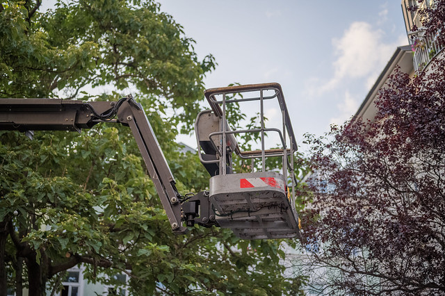 Mobile elevating work platform with trees in the background