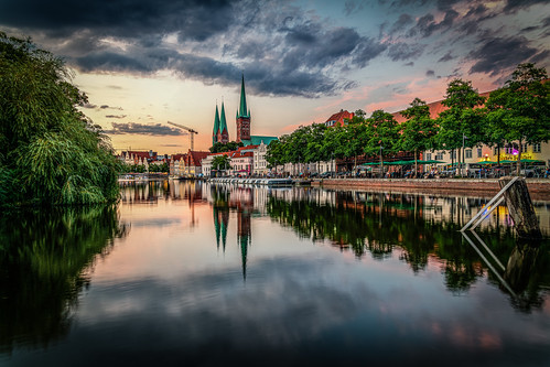 church trave river cityscape trees architecture reflexions clouds sky sunset sundown lights afterglow outdoor