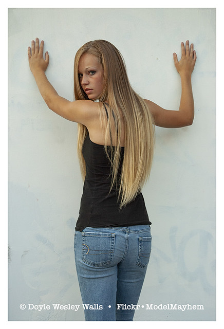 Elegant Anna, Long-Haired Blonde in Blue Jeans and a Black Top