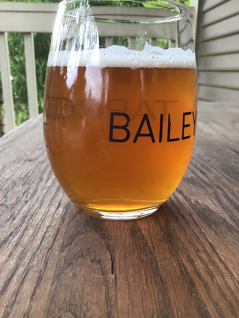 Asylum Ale by Mt Tabor brewing, in glass on table outside