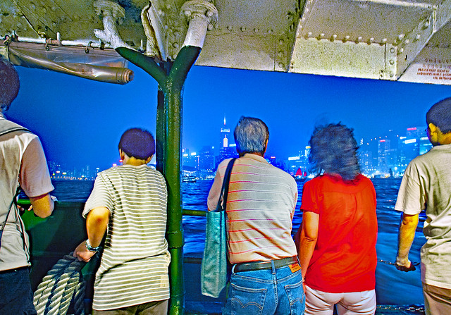 China 2009. Hong Kong. Crossing Victoria harbour by night on board a ferry.