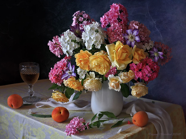 With a bouquet of August flowers and peaches