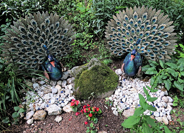 Decorations in a woodland flower garden