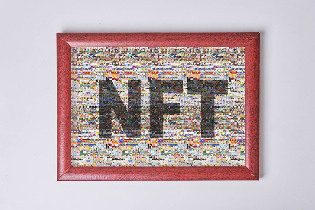 A picture frame with a collage photos NFT art on white wal… - Flickr