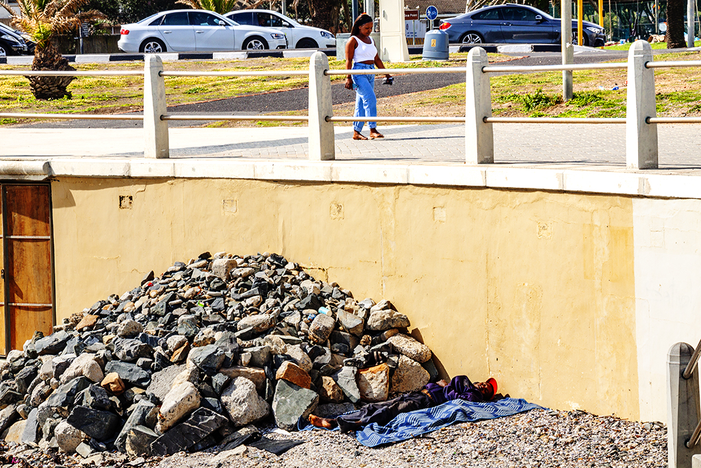 Homeless man sleeping in Green Point on 8-31-21--Cape Town