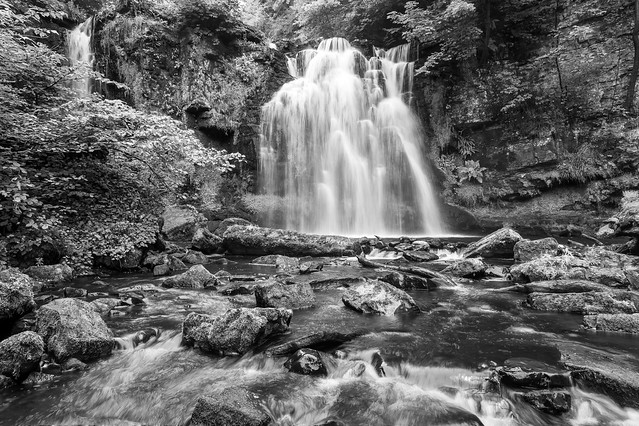 Drop of a waterfall, Lynn Falls, Caaf Water, Lynn Glen, Dalry, North Ayrshire, Scotland, UK B&W