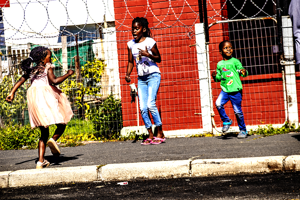 Kids dancing on Goodwood sidewalk on 9-8-21--Cape Town