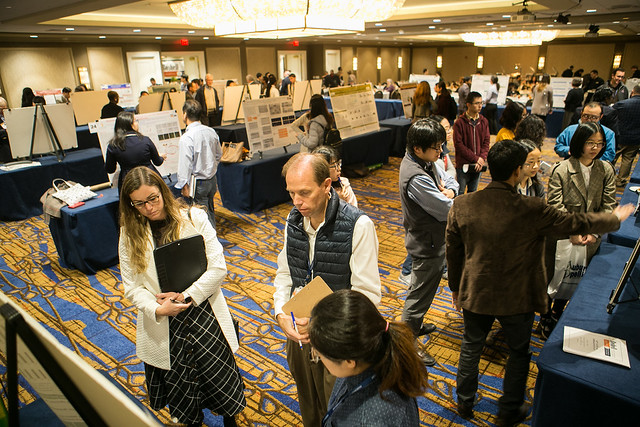 Previous Boshell event attendees view research posters.