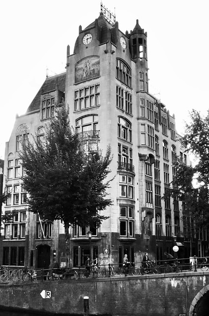 A beautiful tall and old building on the canal , gracht , photograph converted to black and white , Martin’s photograph , Amsterdam , Noord Holland ; North Holland , Nederland ; the Netherlands , September 4. 2010