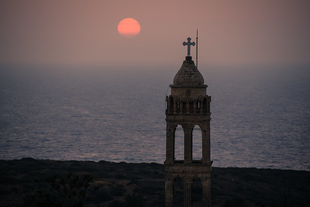 hazy sunset beyond the monastery