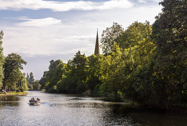 The River Avon with the Spire of Holy Trinity Church , the place of baptism, marriage and burial of William Shakespeare .