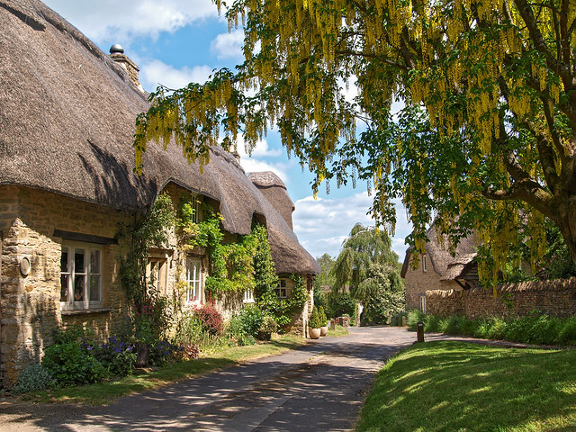 Thatched cottages on a  lane in quiet Great Rollright, Oxfordshire, England
