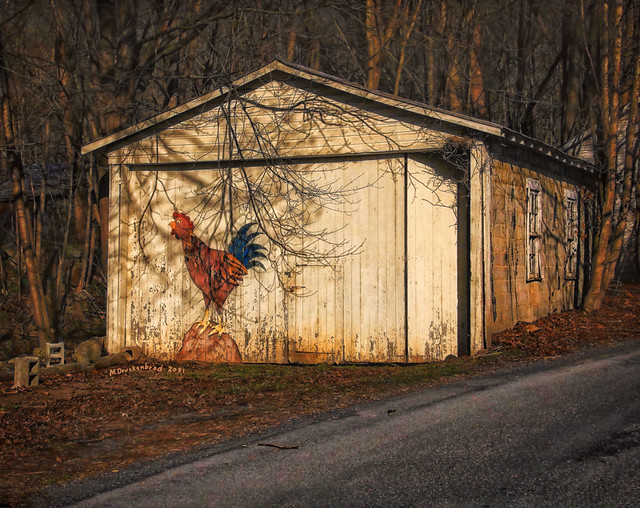 White Building with Rooster in Lost River WV at Sunset