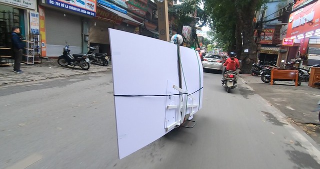 Plastic sheet are flying on the street??? Ridiculously overloaded motorbikes