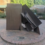 India Sculpture by Anthony Caro. Made from the steel of an old ship named India. It was donated to WWU around 1978; my graduation year.

A memory, at that time was that people questioned it&#039;s value. $55,000 in 1978 dollars. One member of WWU&#039;s Art Acquisition Committee was quoted as saying, &amp;quot;a good price for a Caro Sculpture.&amp;quot;

My own thinking was that much of the price was related to the name of the artist. Celebrity value. Still, the money came from a private foundation.

Being made from scrap iron, some folks wondered, &amp;quot;why this and not necessarily something else?&amp;quot; What&#039;s the point?

Like so many things, it was a campus controversy. For a few weeks after it&#039;s installation, amateur artists dug holes and installed various works of art on campus grounds. A small littering of &amp;quot;people&#039;s art.&amp;quot;

One morning, a large pile of old tires was left in Red Square with a sign on it reading &amp;quot;Pakistan.&amp;quot; Campus maintenance staff removed that.

As I view India, now so many years later, it looks like it has endured well. Built to last; like so many of the buildings on campus. It was well built.