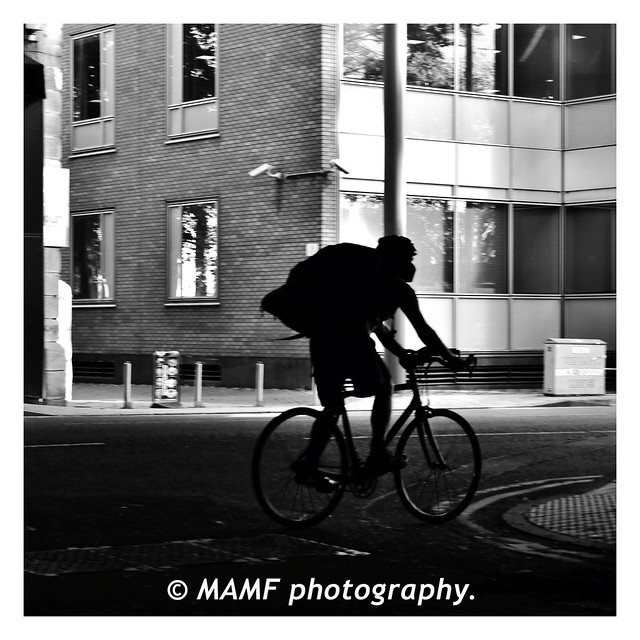 Batman on a bike. (Leeds city centre.)b