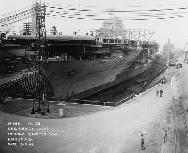 USS HORNET (CV-8) in Newport news Shipbuilding and Drydock Company, Virginia, quarter bow view, in drydock, under construction March 3rd 1941.