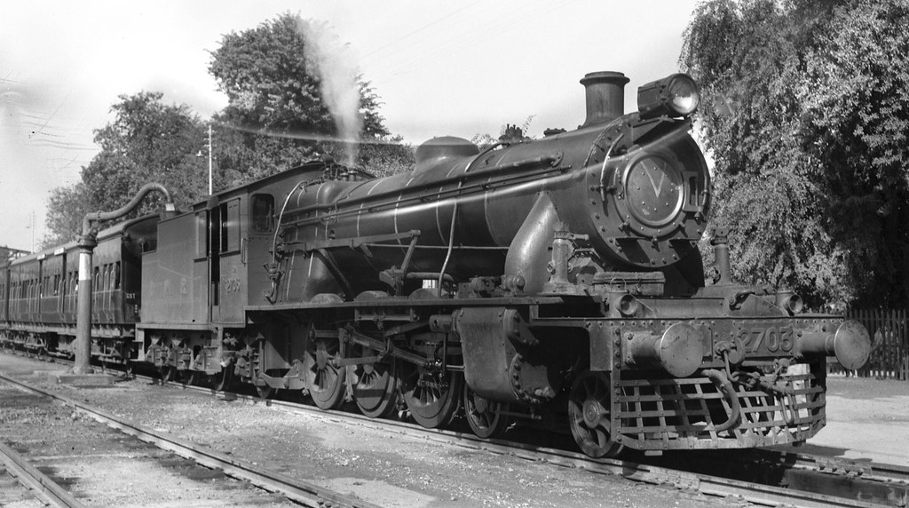 India Railways - North Western Railway - NWR class XA2 4-6-2 steam locomotive Nr. 2703 and passenger train at Nowshera (Pakistan) (Vulcan Foundry 4273 / 1929)