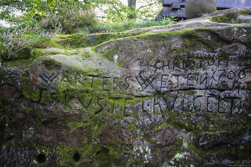 Writing carved into the rock face