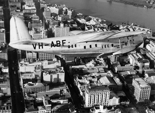 Empire flying boat 'Cooee', operated by QANTAS, circling over Brisbane, 1938