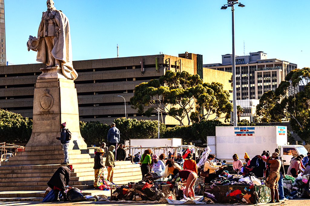 People buying used clothing from steel bins in Grand Parade on 9-29-21--Cape Town