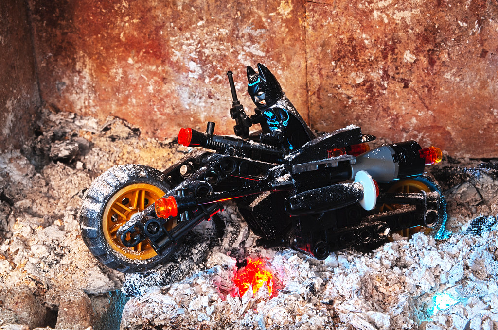 Batman on his Batpod escaping the fire