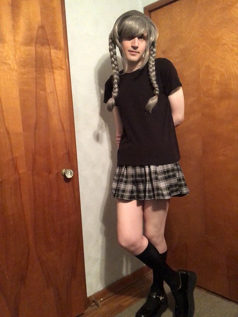 crossdresser in black shirt and pleated plaid miniskirt with Peko Pekoyama wig 7