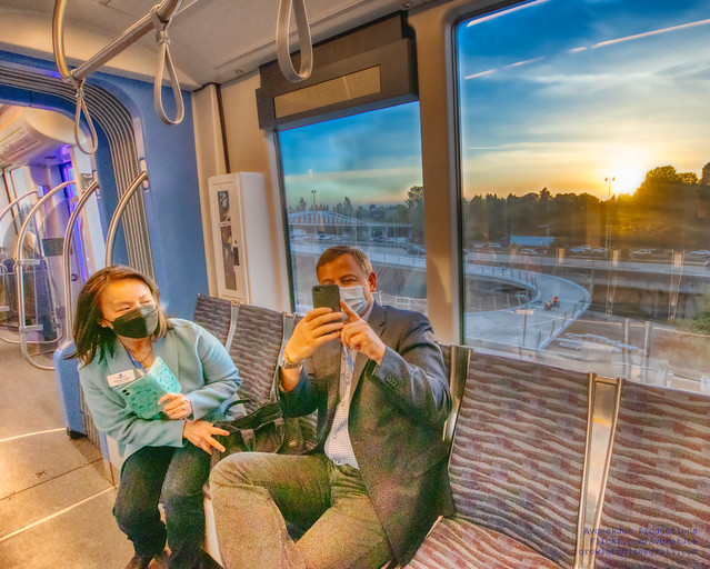 Susan Chang and Rod Dembowski Riding Light Rail While the Sun Sets in HDR