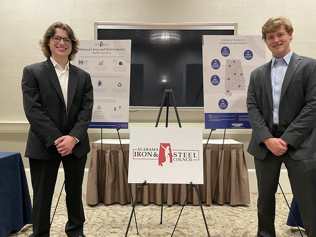 Harbert College of Business seniors in supply chain management Tyler Vassar, left, and Grant Stallworth pose with charts