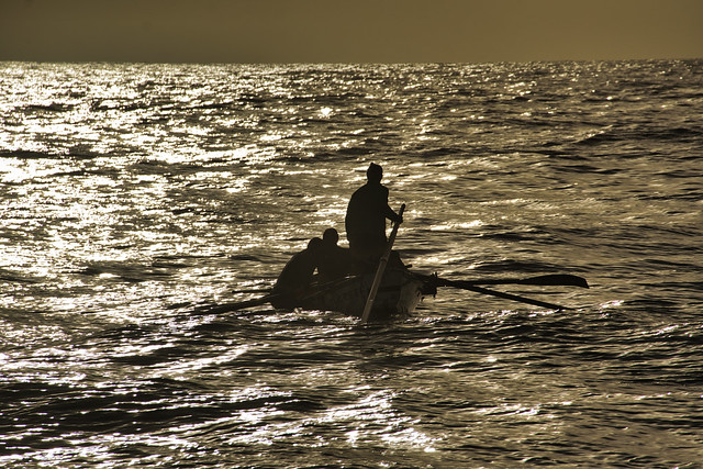 Rowing boat at sunrise