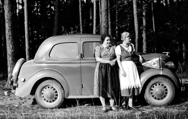 Two German women pose with a Ford Eifel circa WW2