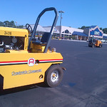 Asphalt Compaction. The rubber tire roller in addition to the steel drum roller helps to provide a smooth finish.