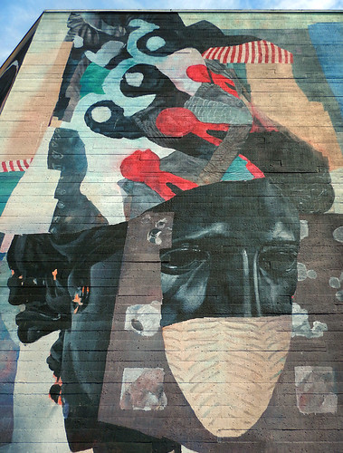 mural on a wall in Vancouver with a COVID mask