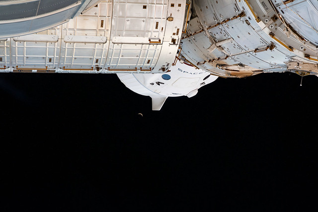 The Moon below the SpaceX Crew Dragon Endeavour