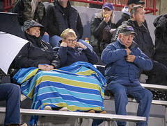 Gretchen, Phyllis, and John Landrum prepare for a chilly, rainy game. Cincinnati Hills Christian Academy vs. Norwood at Shea Stadium in Norwood, Ohio on October 22, 2021