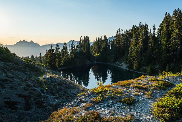 Solo hiker seeking alpine lake solitude