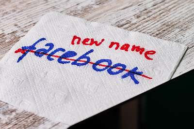 A piece of napkin with Facebook text on it crossed and New name