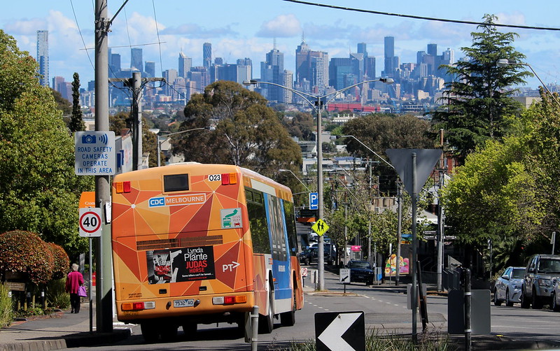 Bus on route 612 in Camberwell, showing city skyline