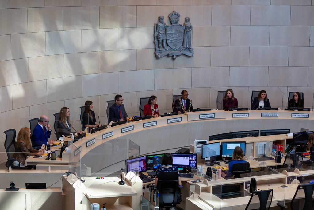 Members of Edmonton's city council sit in council chambers