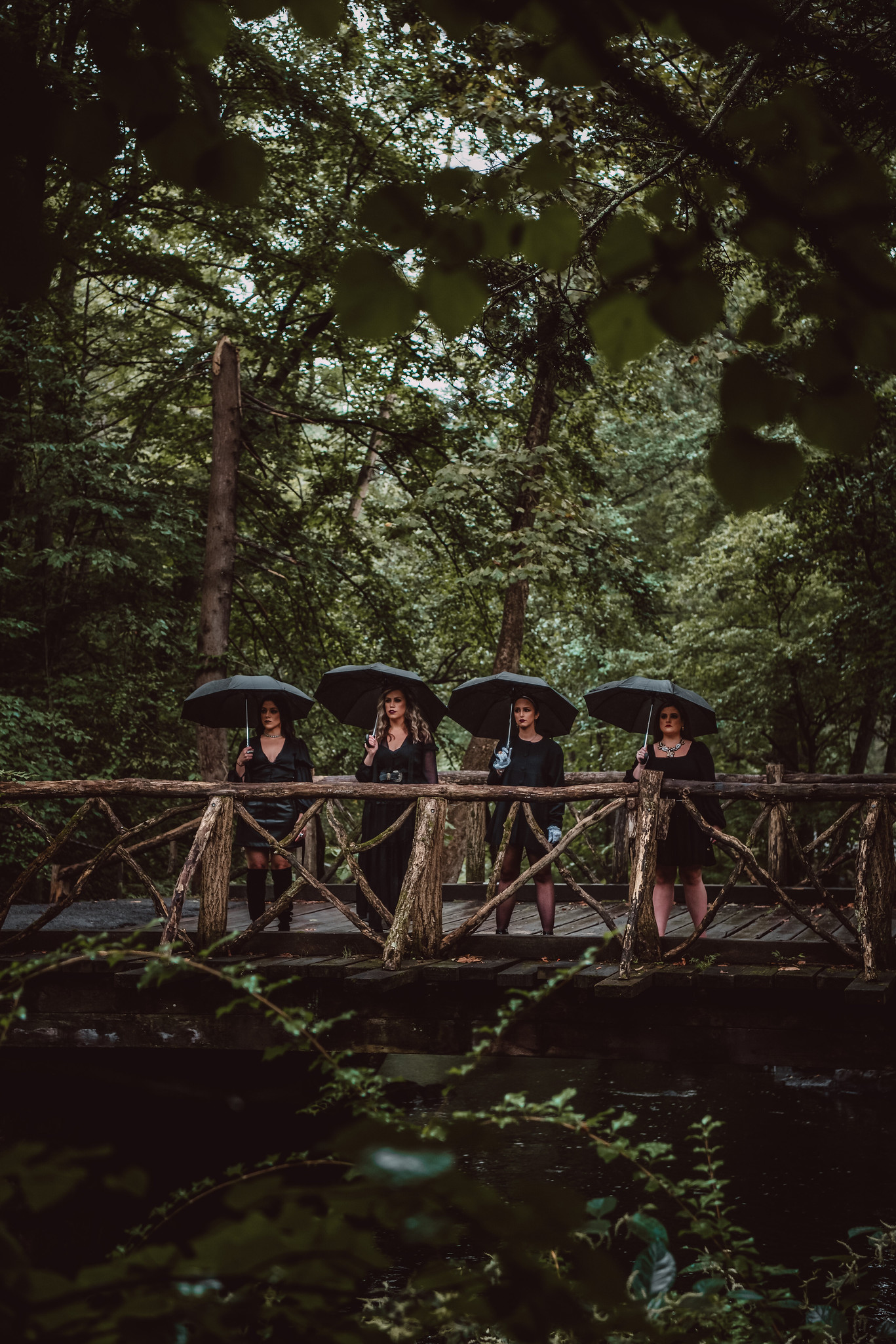 four women at Headless Horseman Bridge in Sleepy Hollow Cemetery 