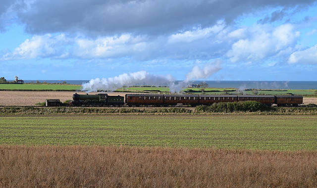 B12 Locomotive No.8572 passing Weybourne Windmill & Coastguard Cottages,  working the 13.40 service from Sheringham to Holt. North Norfolk Railway. 31 10 2021