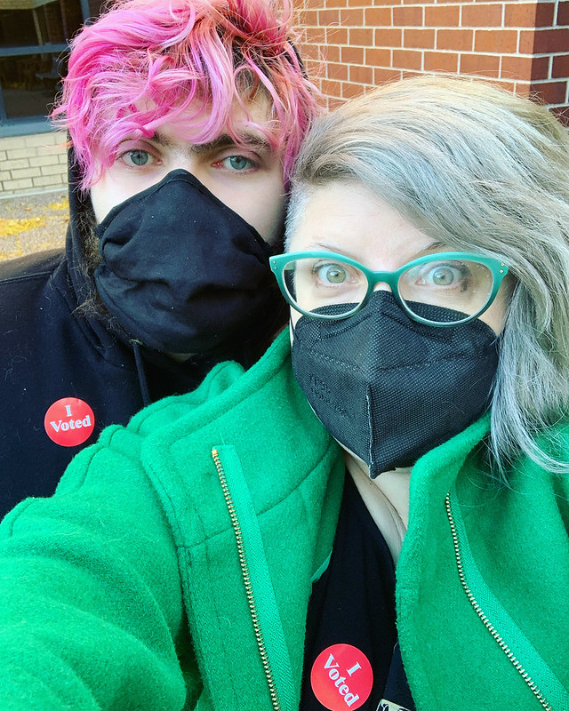 Pic of my son and I outside our polling station, wearing covid masks and our I Voted stickers