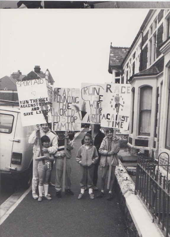 1985 Sport Aid Wales - Running to Stop Famine supporters with placards in Cardiff streets