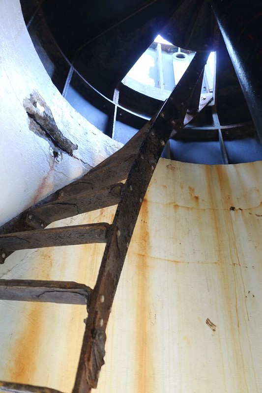 Steep and rusty spiral stair leading up into the Punta Gorda Lighthouse where there used to be a fresnel lens