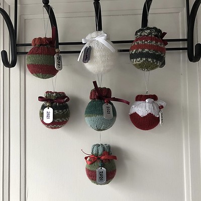 Lise (Mattedcat) knit these ball ornament “sweaters” for this year’s family ornament exchange. Pattern is Christmas Ornament by Valya Boutenko.