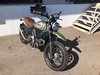 Motorcycle with gray tank inserts and brown mustang seat